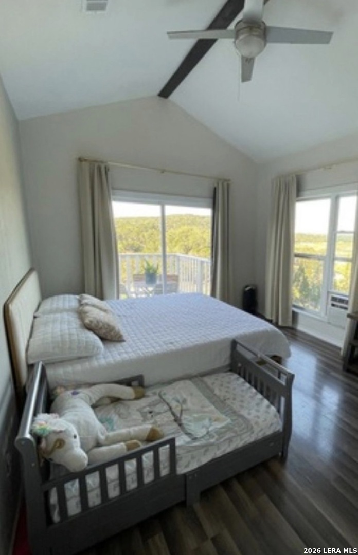 272 Plum Cove Road Lakehills, TX 78063 - Photo 7 of 11 a bed sitting in a bedroom next to a window