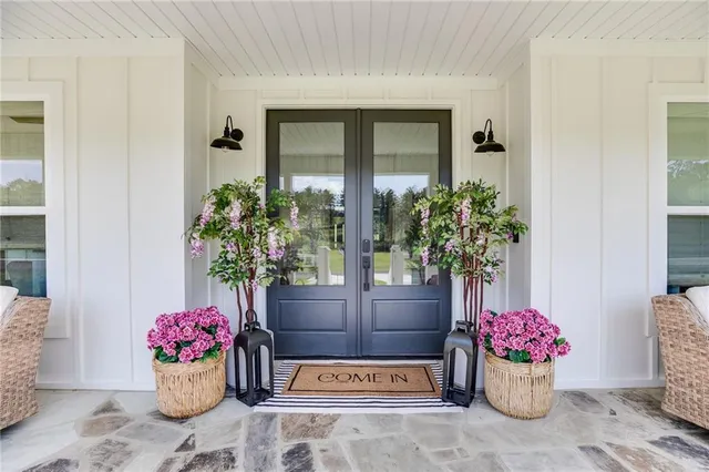 a open kitchen with white cabinets and stainless steel appliances