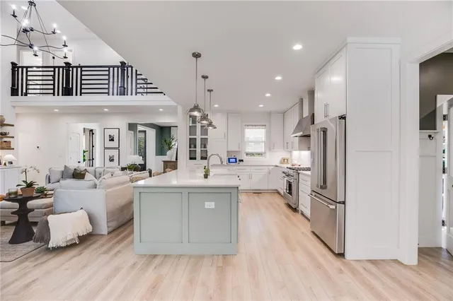 a bathroom with double vanity sinks and two mirror