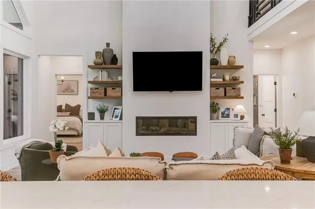 a bedroom with a balcony a bed and a couch