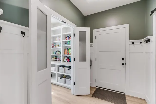 a bathroom with a shower and a sink
