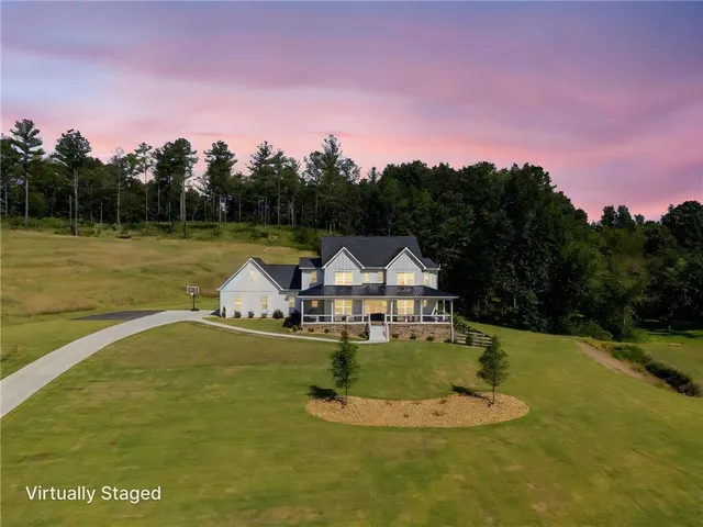 a swimming pool with some trees in the background