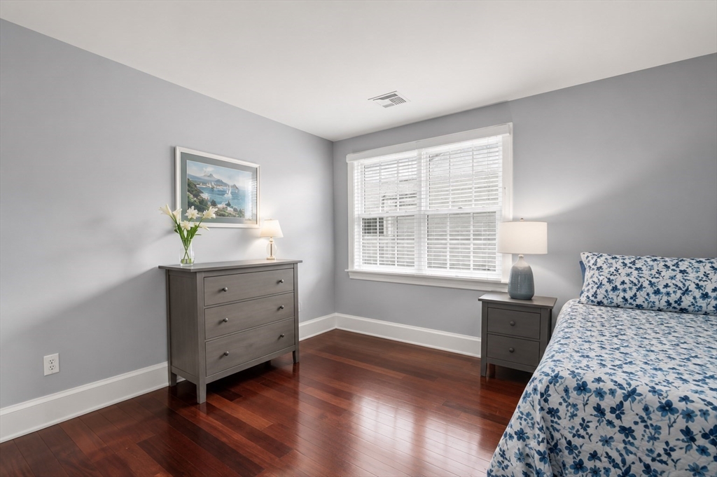 29 Maple Lane, Unit 29 Medfield, MA 02052 - Photo 23 of 42 a bedroom with a bed and a window
