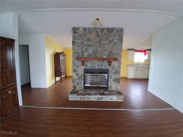 a view of a backyard with large trees