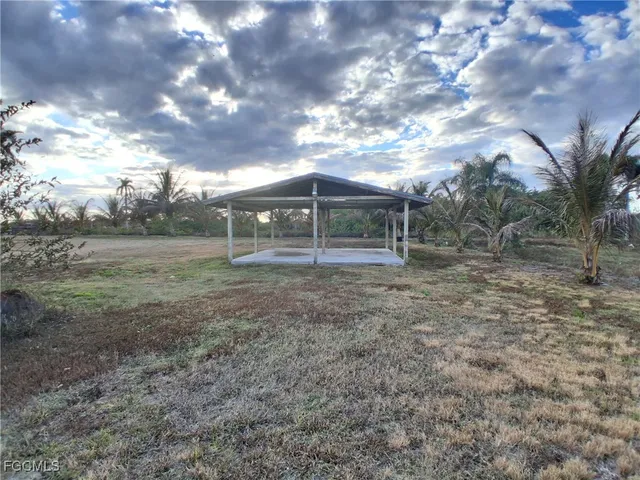 a view of a house with a back yard
