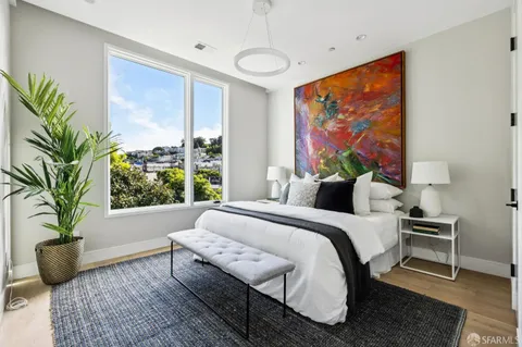 a bed room with a bed and a couch