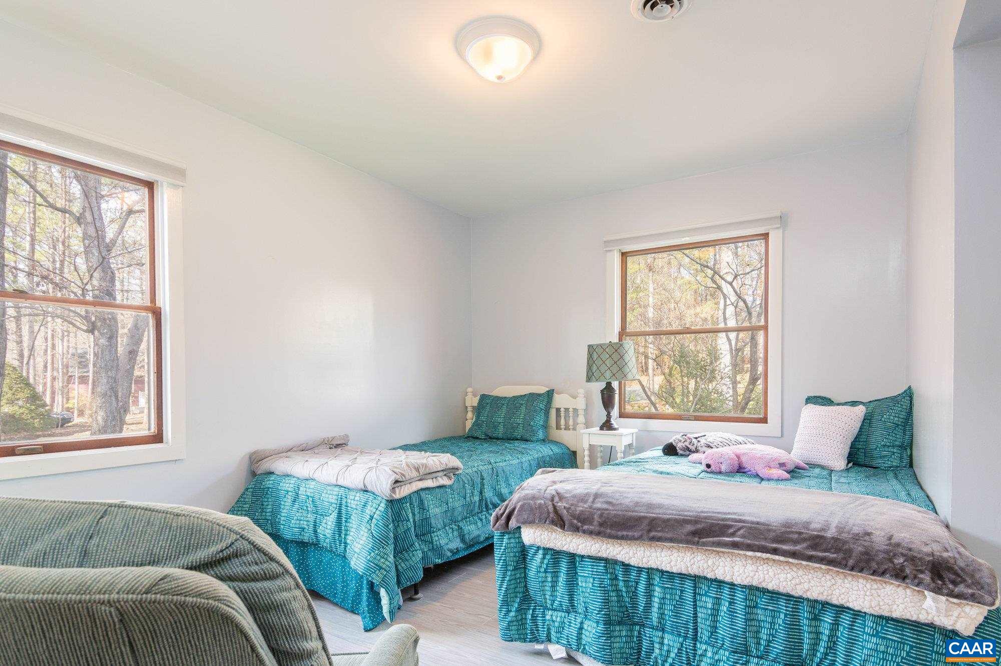 39 Tanglewood Road Palmyra, VA 22963 - Photo 12 of 33 a bedroom with two beds and a large window