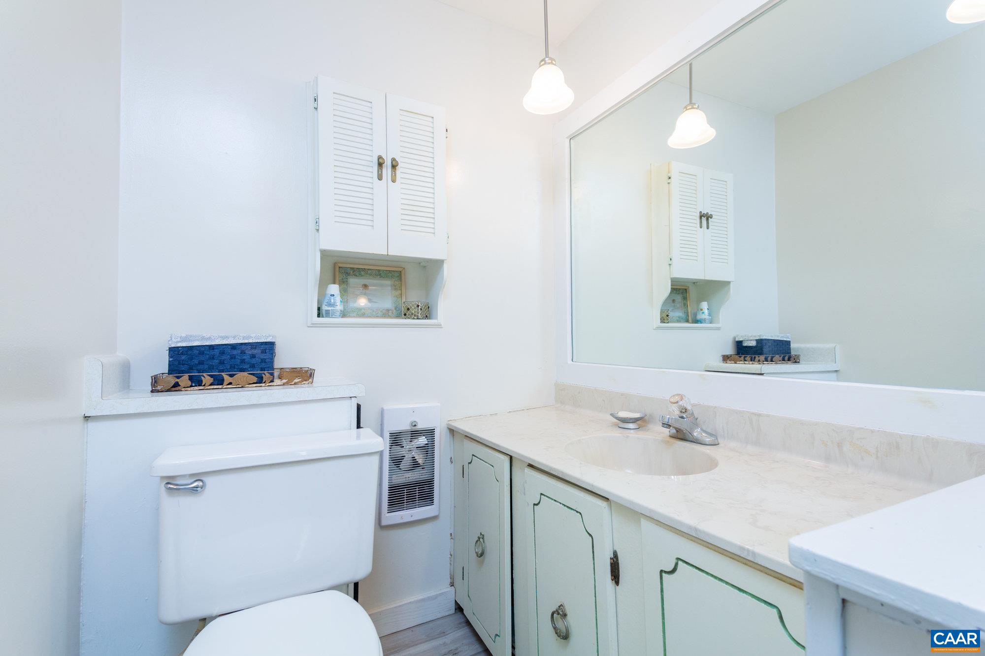 39 Tanglewood Road Palmyra, VA 22963 - Photo 23 of 33 a bathroom with a sink toilet vanity and tub