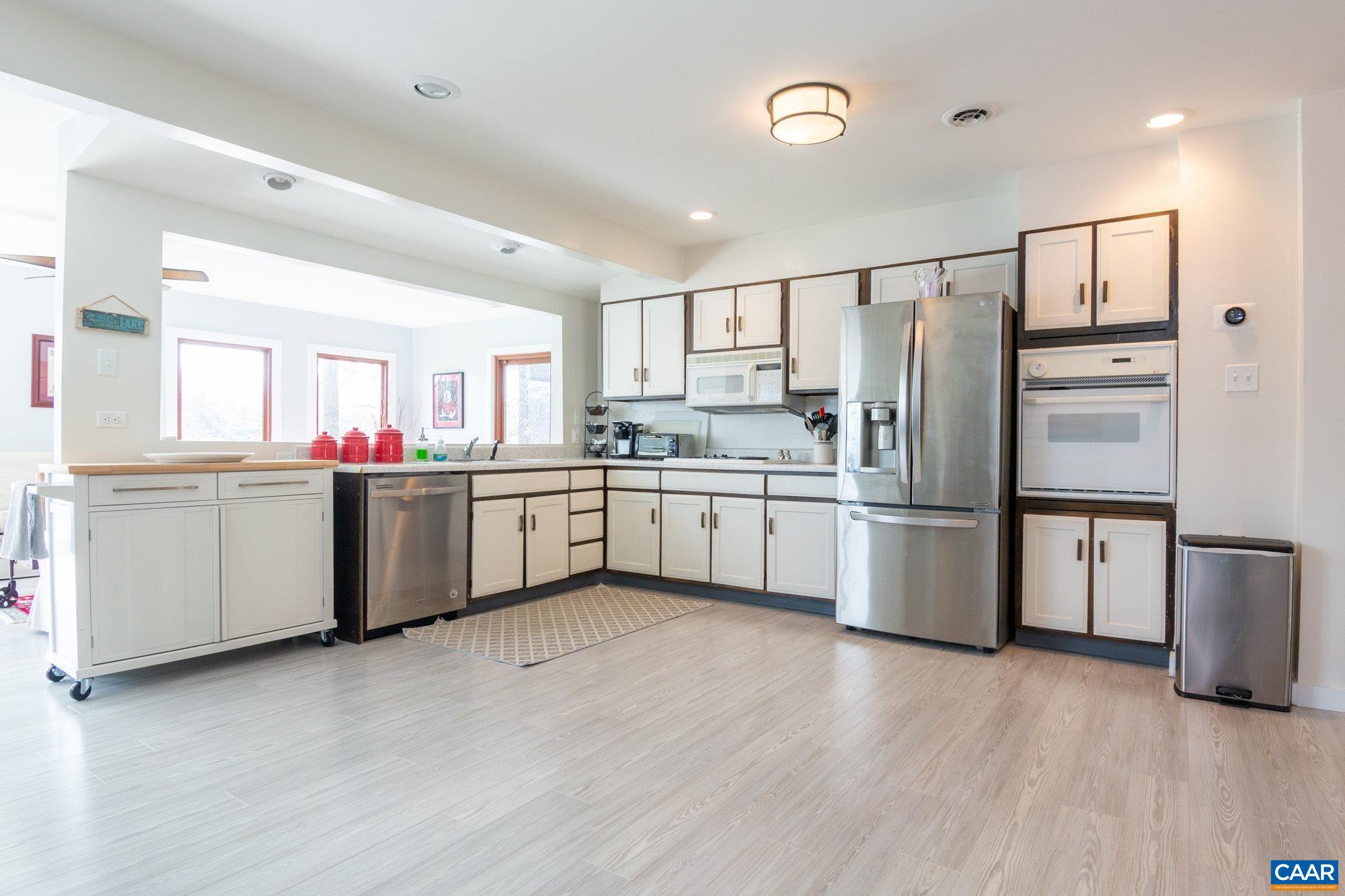 39 Tanglewood Road Palmyra, VA 22963 - Photo 5 of 33 a kitchen with stainless steel appliances kitchen island a refrigerator sink and cabinets