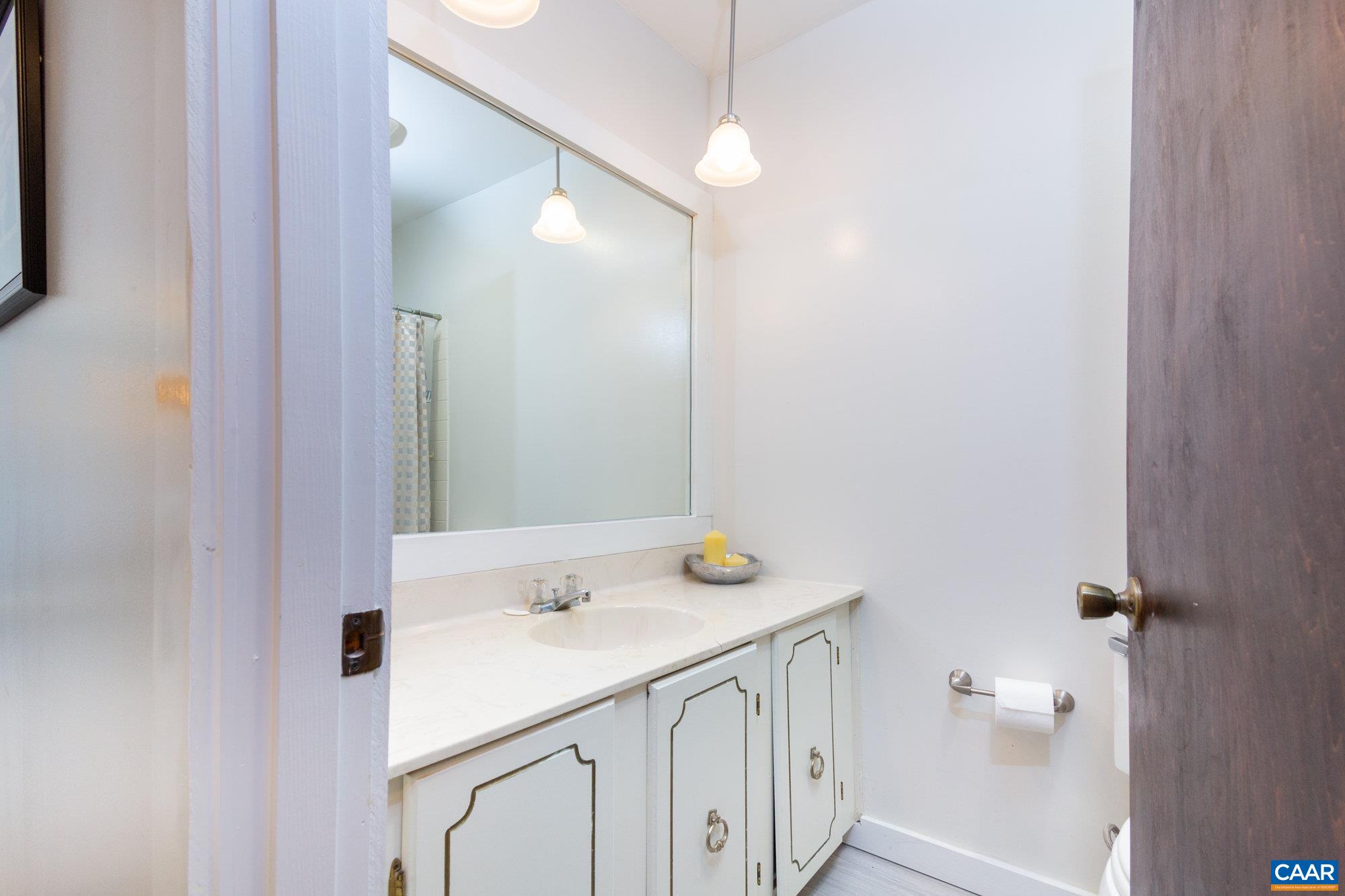 39 Tanglewood Road Palmyra, VA 22963 - Photo 10 of 33 a bathroom with a sink a toilet and a mirror