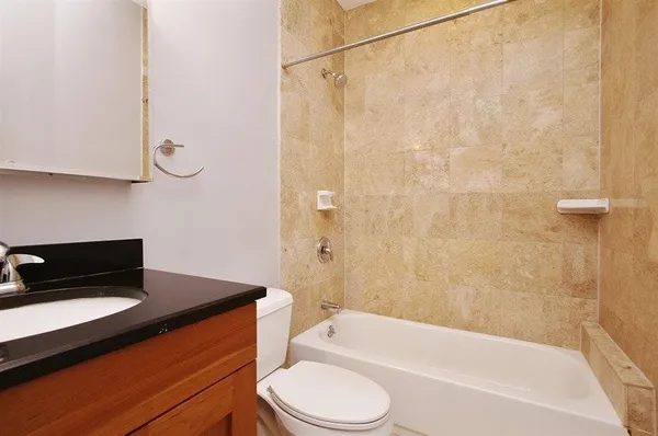a bathroom with a sink a toilet and a bathtub