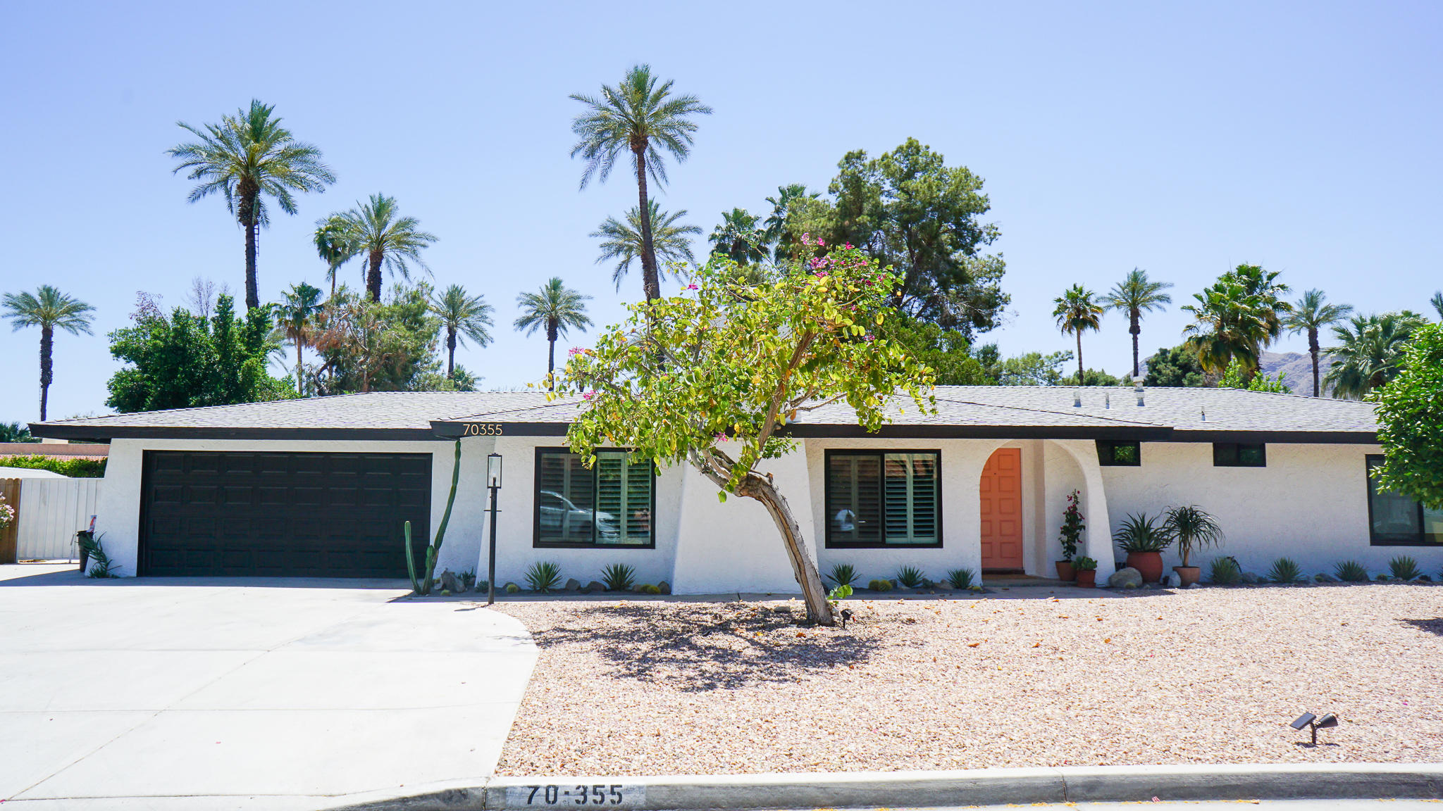 70355 Cobb Road Rancho Mirage, CA 92270 - Photo 1 of 27 a front view of a house with a yard and garage
