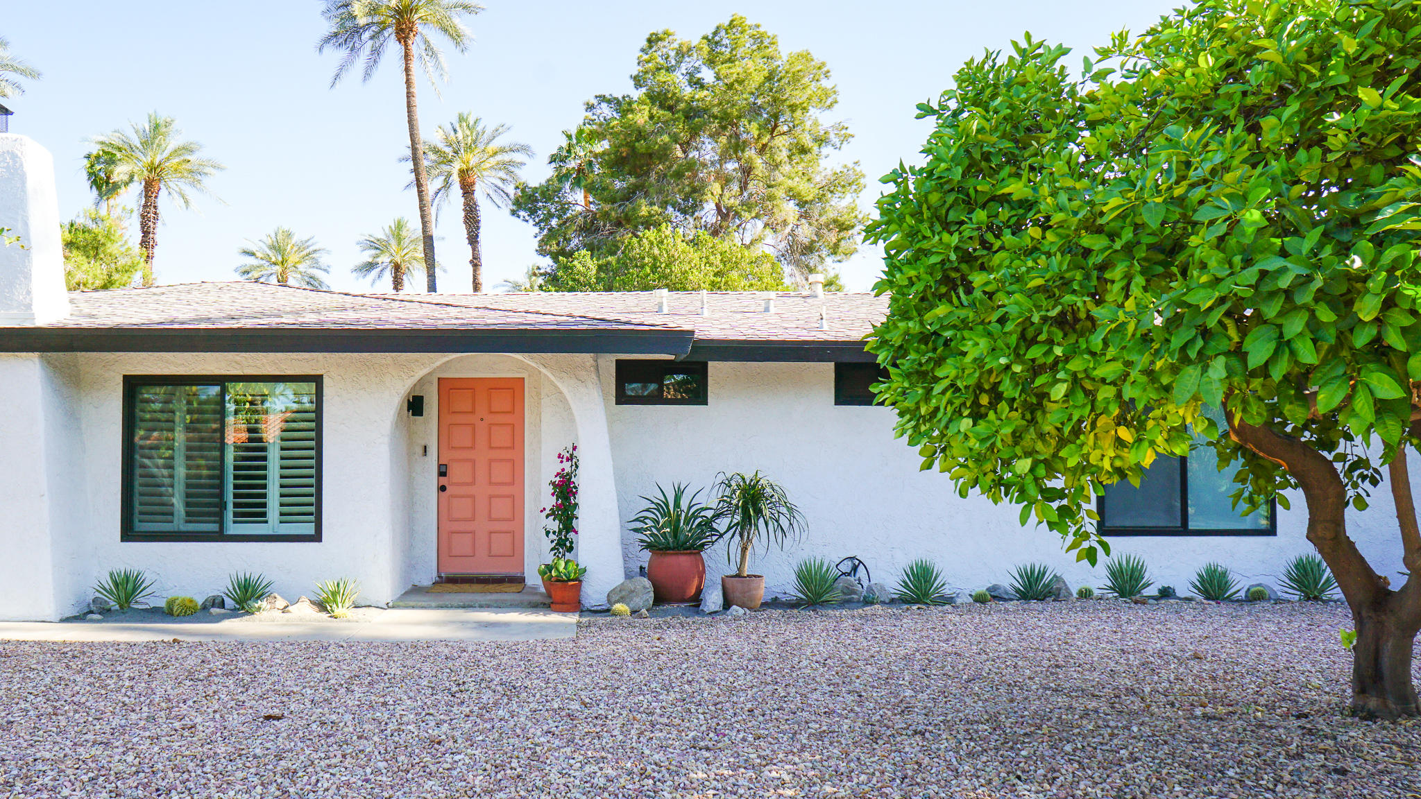 70355 Cobb Road Rancho Mirage, CA 92270 - Photo 2 of 27 a front view of a house with a garden