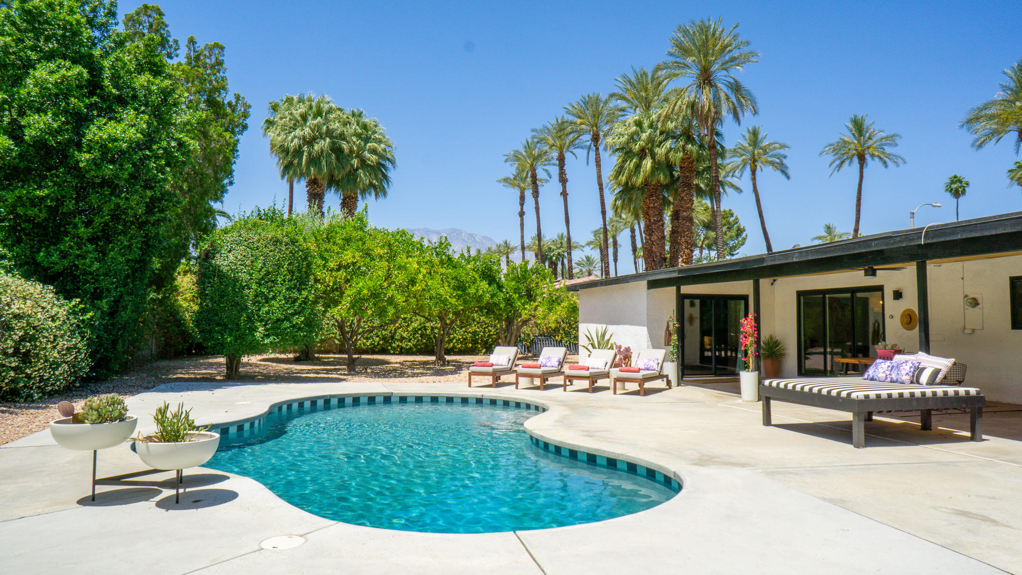 70355 Cobb Road Rancho Mirage, CA 92270 - Photo 25 of 27 a swimming pool with outdoor seating yard and barbeque oven