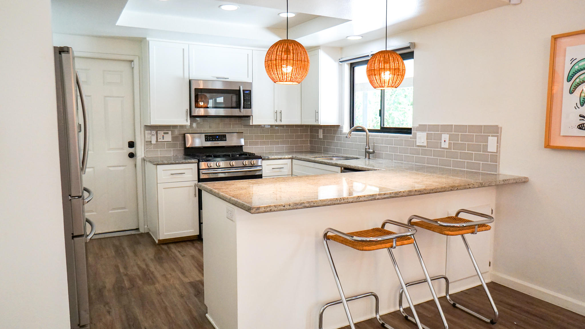 70355 Cobb Road Rancho Mirage, CA 92270 - Photo 9 of 27 a kitchen with stainless steel appliances granite countertop a stove a sink and a microwave