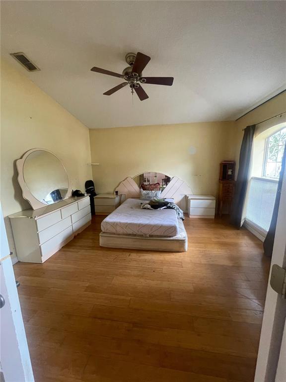 396 Kettering Road Deltona, FL 32725 - Photo 14 of 25 a bedroom with a bed and window