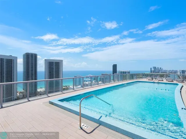 a view of a swimming pool with a lounge chair
