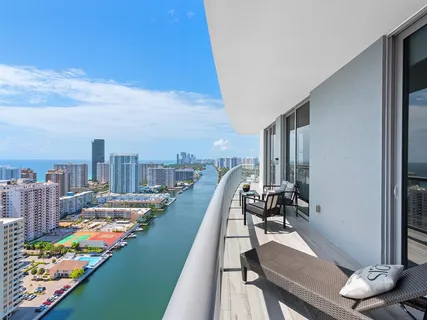 a view of swimming pool with outdoor seating