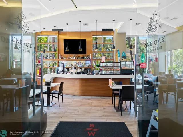 a living room with dining room and kitchen view