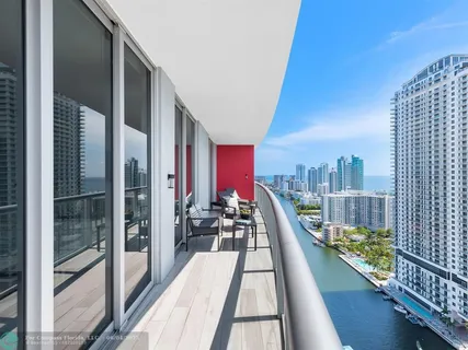 a view of balcony with two chairs and a table