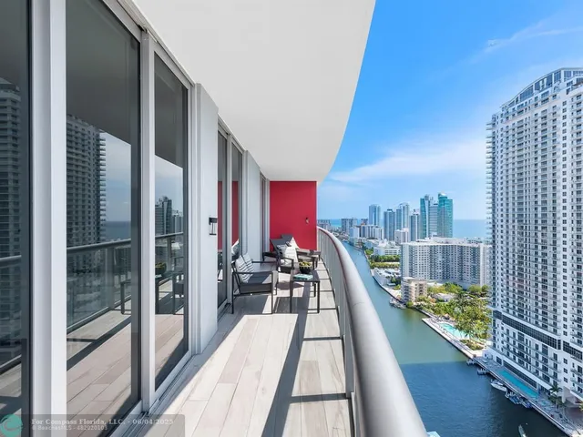 a view of balcony with two chairs and a table
