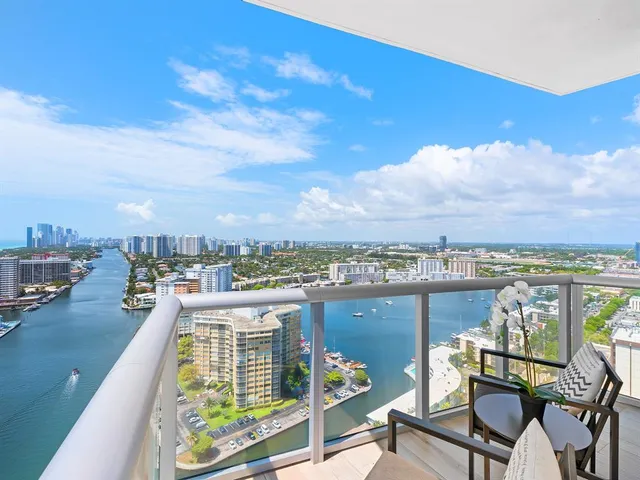 a view of a chairs and table in a terrace