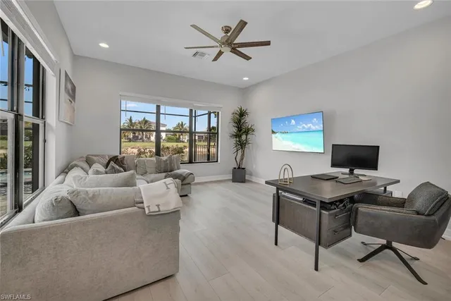 a living room with furniture and a window