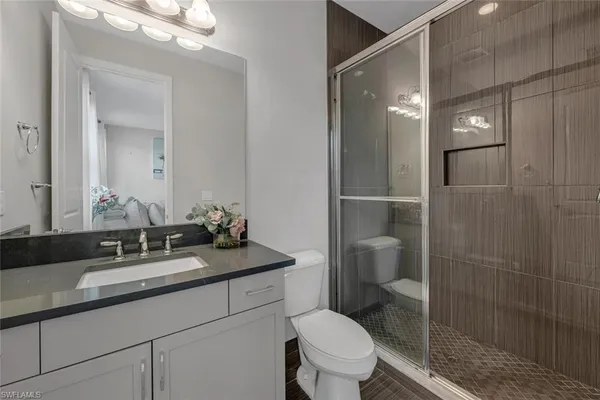 a utility room with sink dryer and washer
