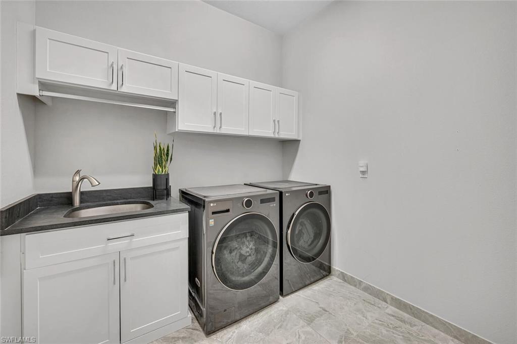 4541 Azalea Drive Naples, FL 34119 - Photo 27 of 35 Laundry Room with tub sink and storage (downstairs)