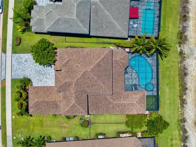 a view of a swimming pool with a patio