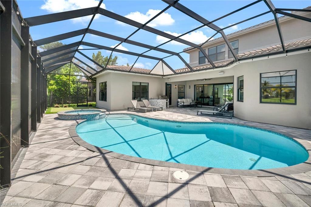 4541 Azalea Drive Naples, FL 34119 - Photo 33 of 35 Pool and spa with paver deck and putting green
