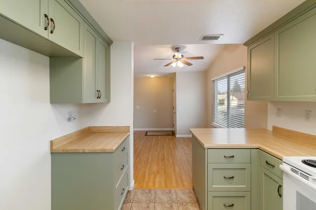 a view of a kitchen cabinets and a sink