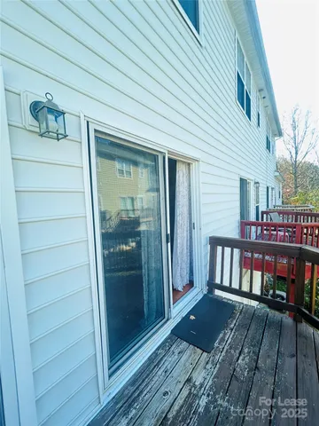 a view of a balcony with two chairs