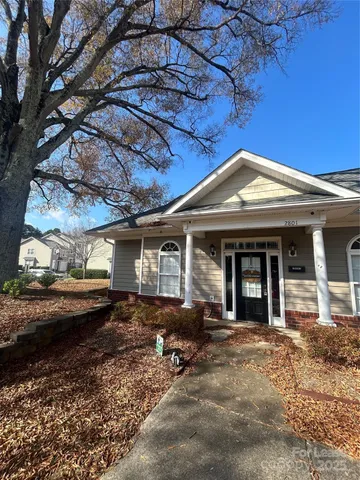 a view of street with a car parked on the road