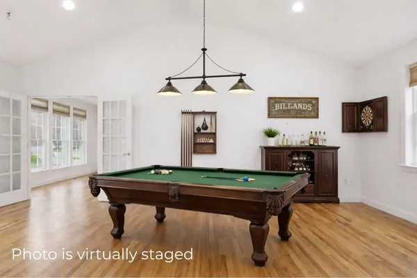 a room with furniture and pool table