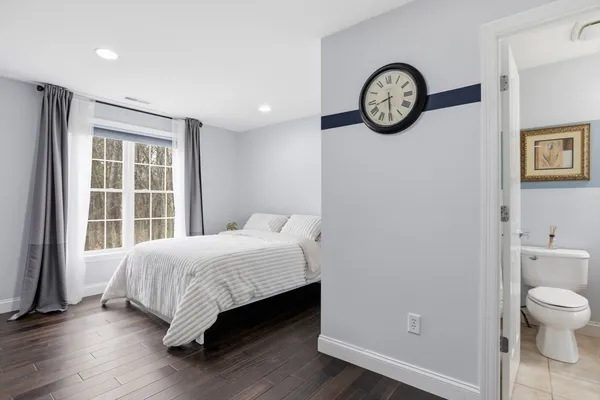 a room with a bed and a window