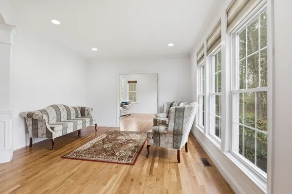 a living room with furniture and a rug