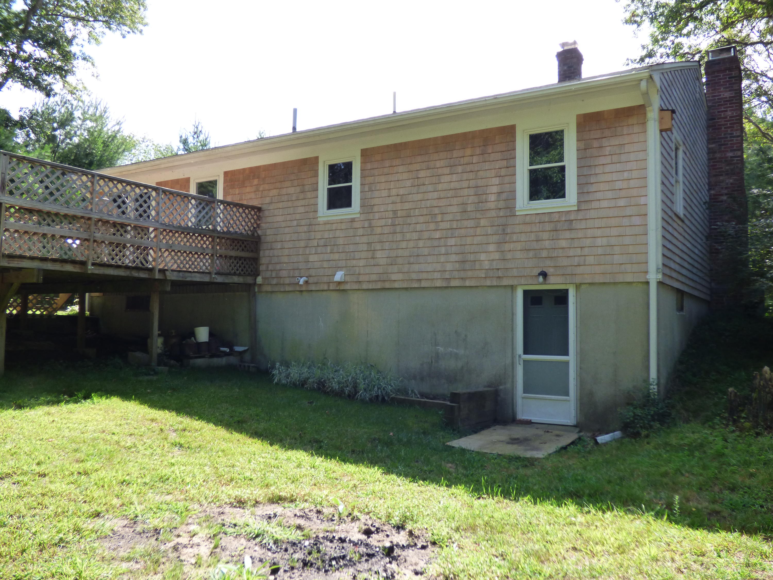 100 Taramac Road Centerville, MA 02632 - Photo 11 of 18 a front view of a house with garden