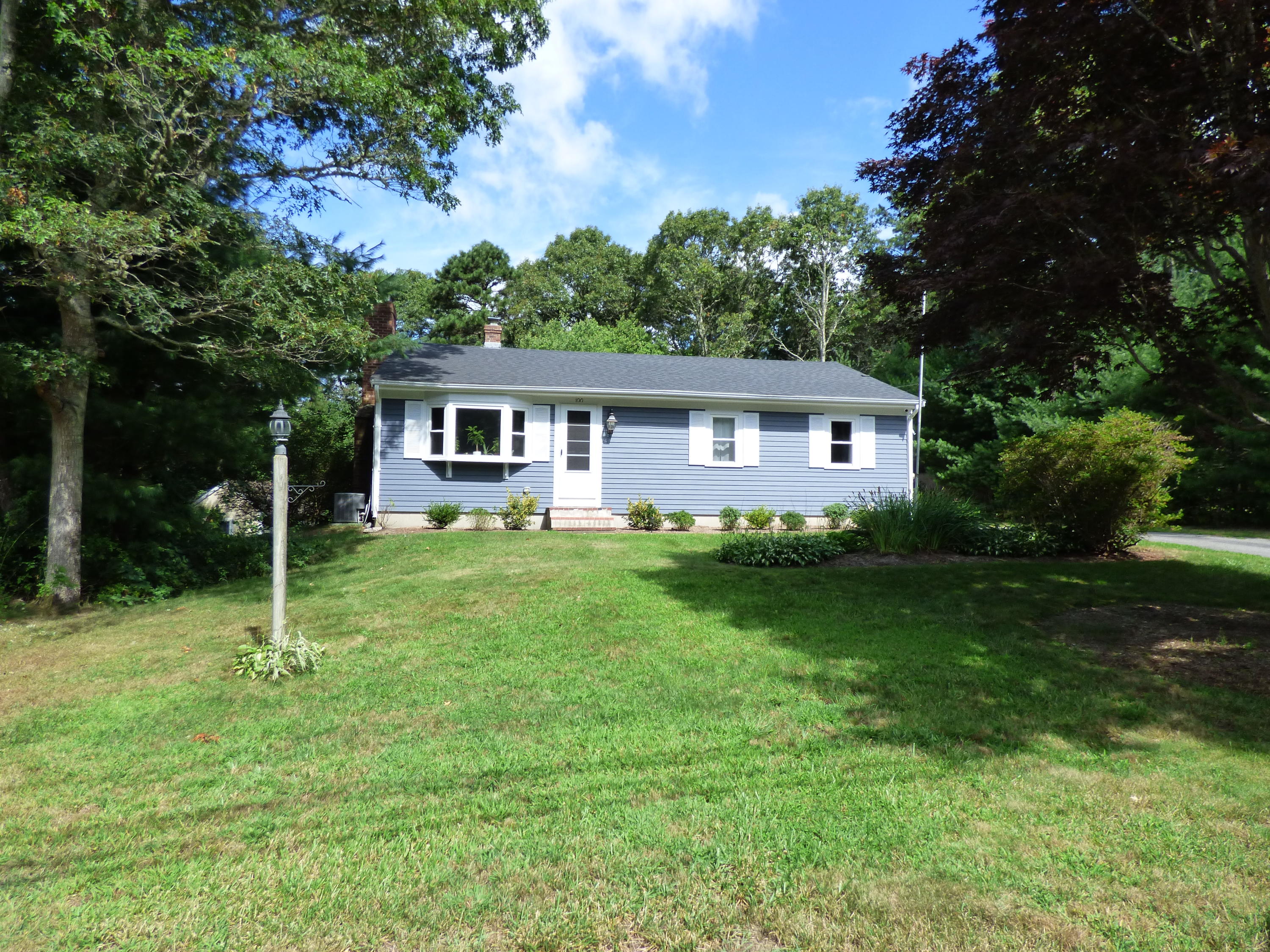 100 Taramac Road Centerville, MA 02632 - Photo 12 of 18 a house view with a garden space