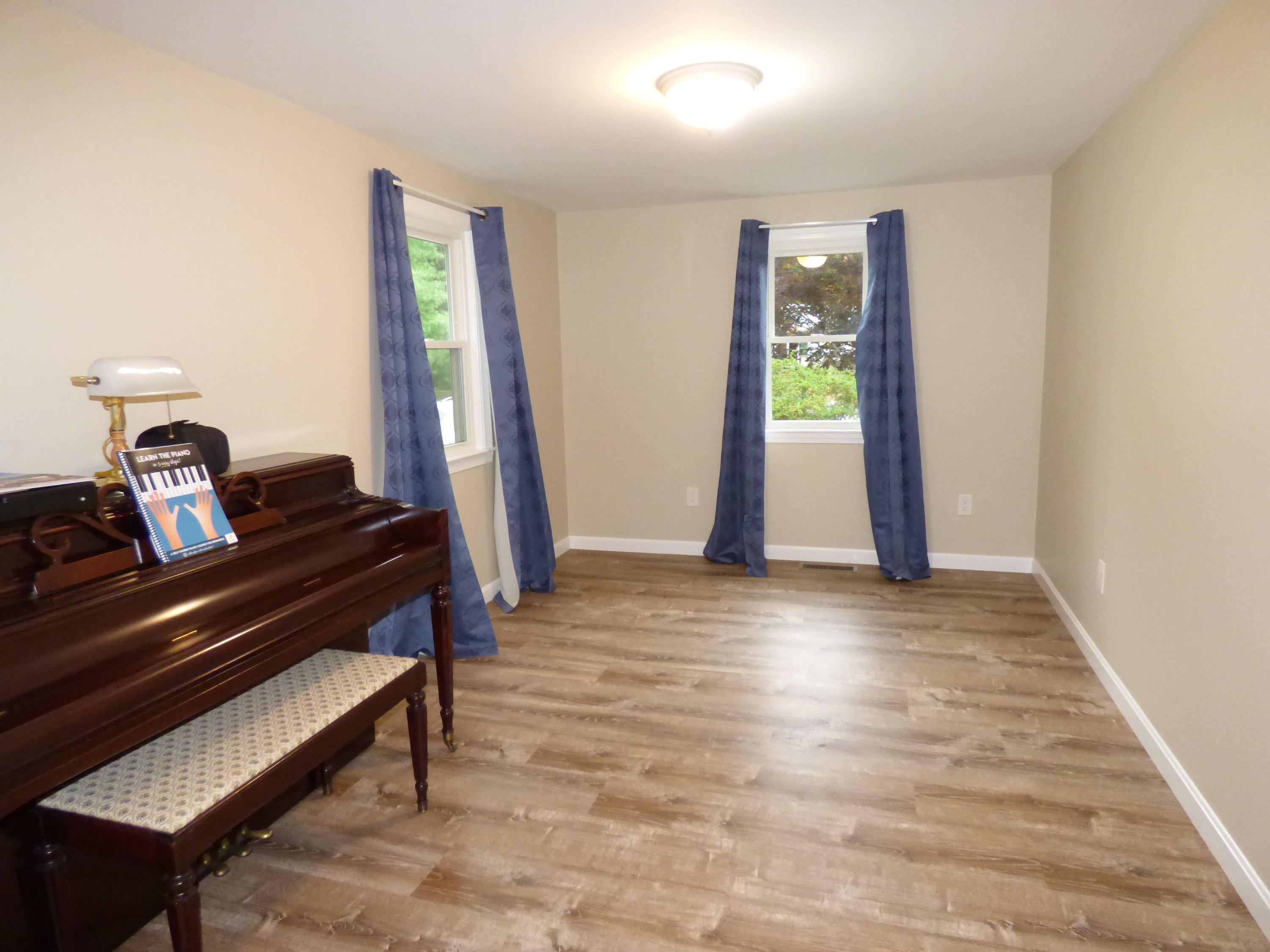 100 Taramac Road Centerville, MA 02632 - Photo 4 of 18 a view of a room with wooden floor and windows