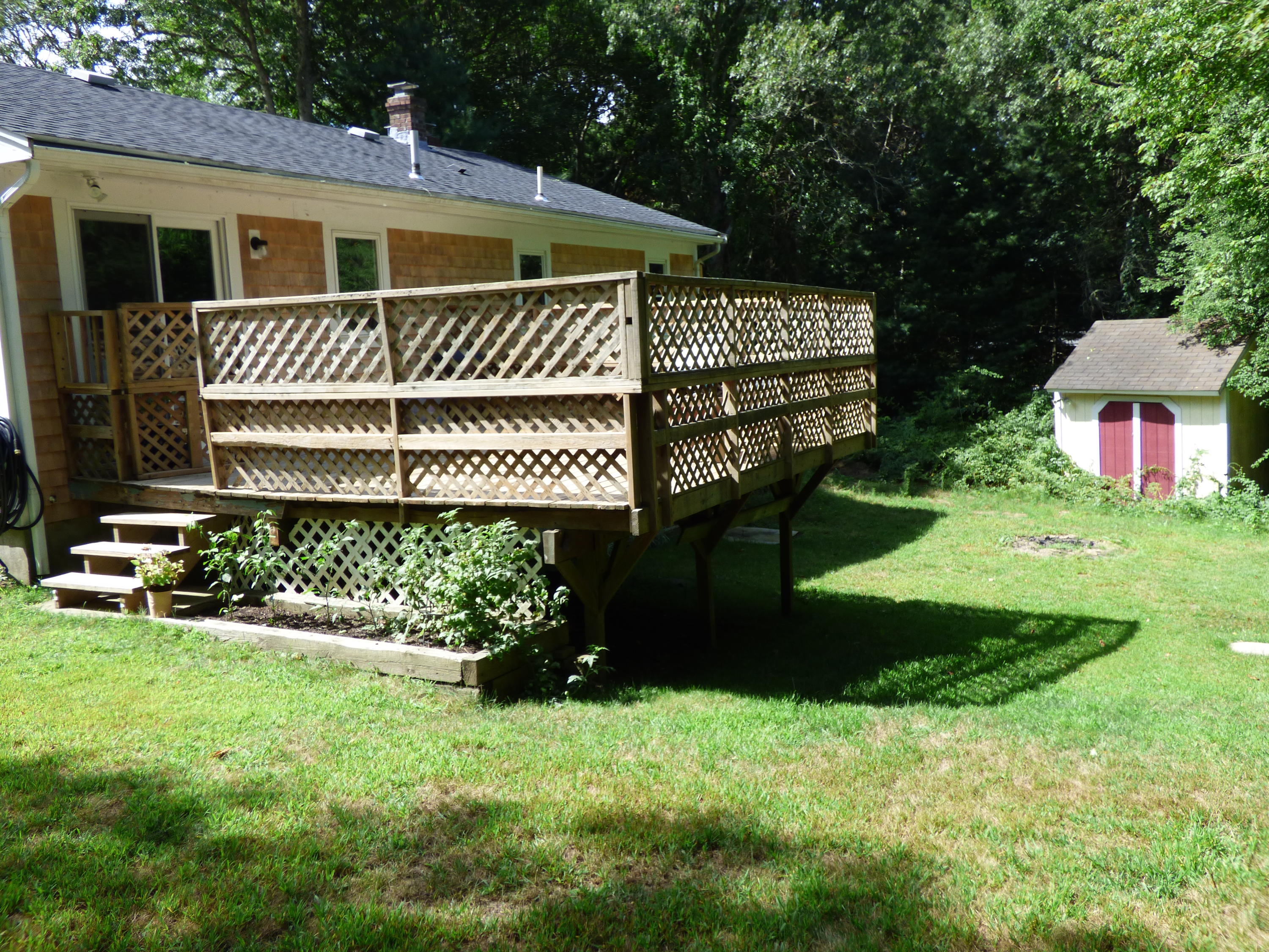 100 Taramac Road Centerville, MA 02632 - Photo 10 of 18 a front view of a house with garden