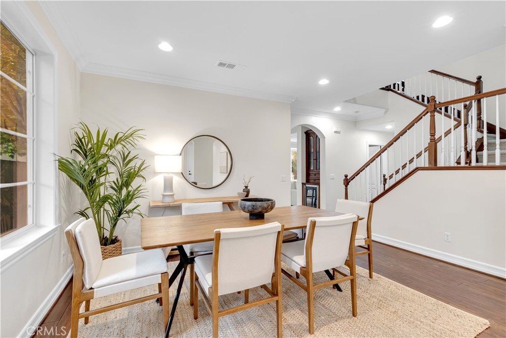 2105 Canyon Circle Costa Mesa, CA 92627 - Photo 11 of 35 a view of a dining room with furniture and a potted plant