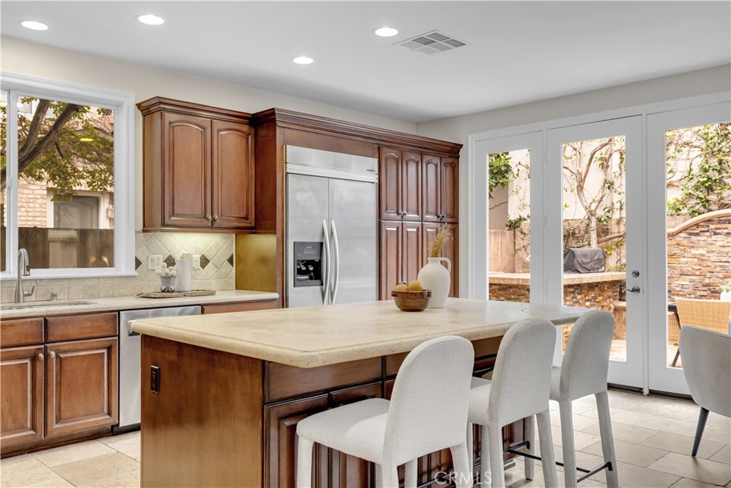 2105 Canyon Circle Costa Mesa, CA 92627 - Photo 12 of 35 a view of kitchen with granite countertop cabinets table and chairs