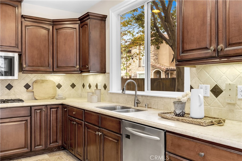 2105 Canyon Circle Costa Mesa, CA 92627 - Photo 15 of 35 a kitchen with a sink and a cabinets