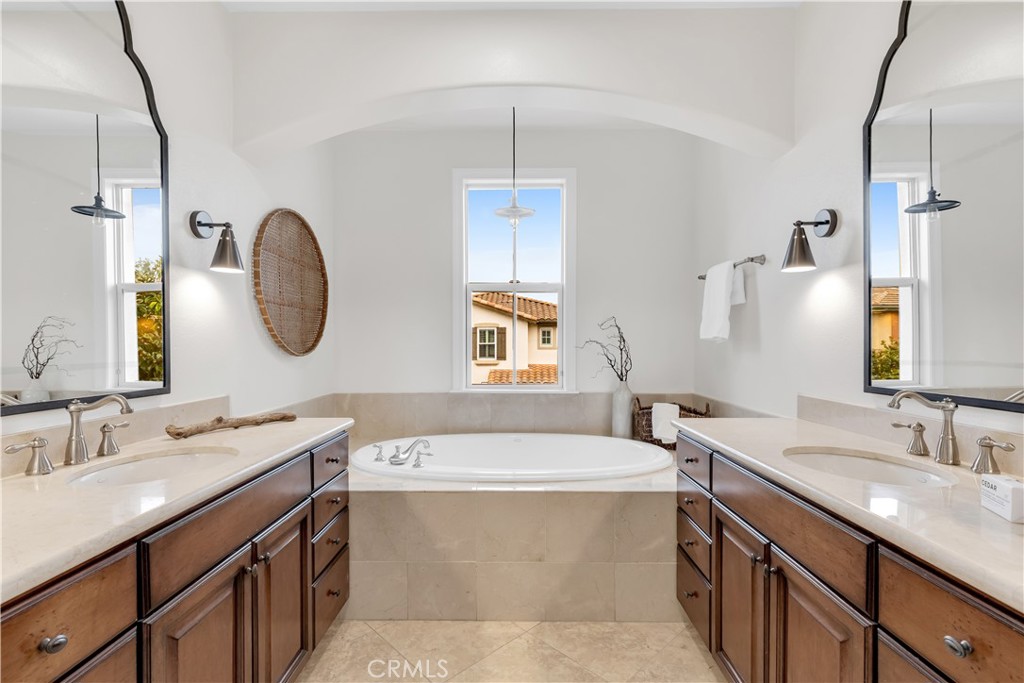 2105 Canyon Circle Costa Mesa, CA 92627 - Photo 23 of 35 a bathroom with a double vanity sink mirror and bathtub