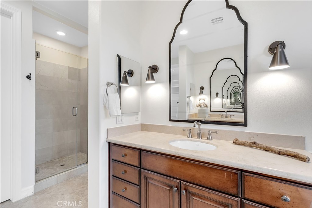 2105 Canyon Circle Costa Mesa, CA 92627 - Photo 24 of 35 a bathroom with a sink and a mirror
