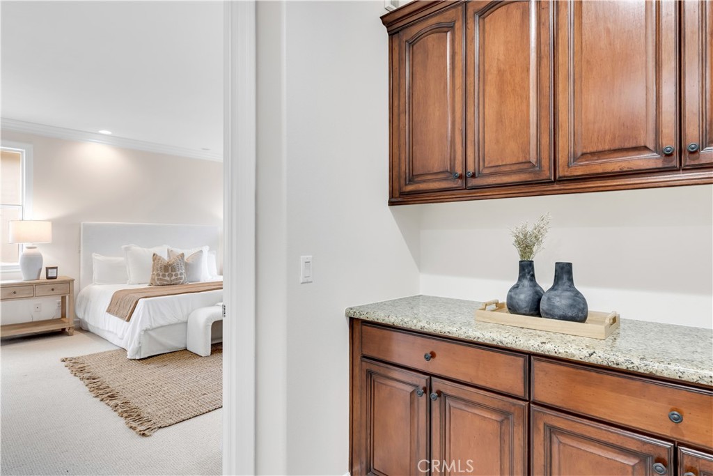 2105 Canyon Circle Costa Mesa, CA 92627 - Photo 27 of 35 a en suite bathroom with a granite countertop sink and a mirror