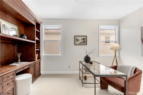 a bedroom with a bed and a chair