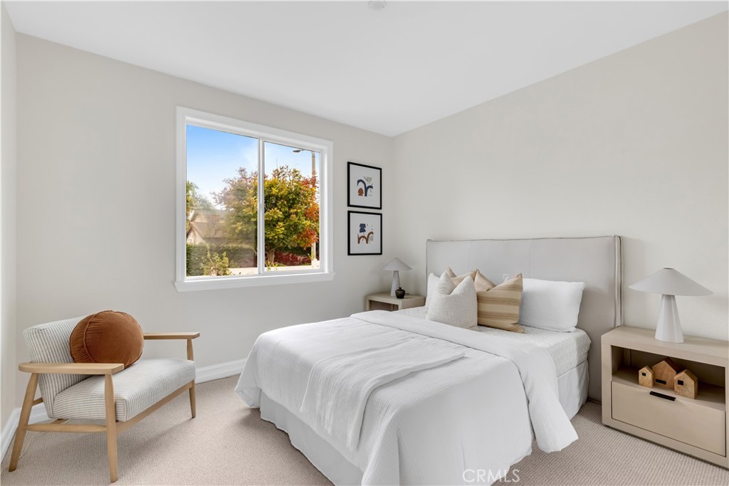 2105 Canyon Circle Costa Mesa, CA 92627 - Photo 29 of 35 a bedroom with a bed and a chair