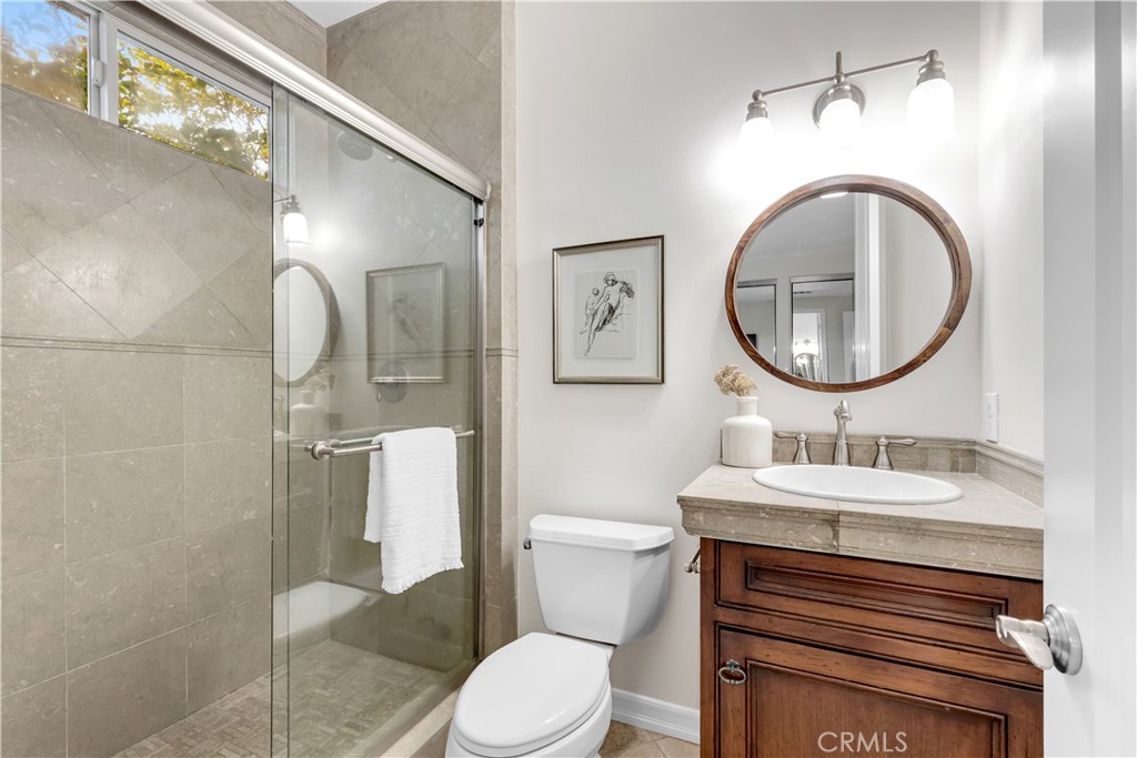 2105 Canyon Circle Costa Mesa, CA 92627 - Photo 31 of 35 a bathroom with a sink a toilet and a mirror